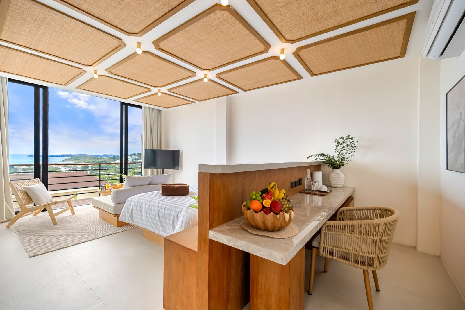 Villa bedroom with rattan ceiling and writing desk